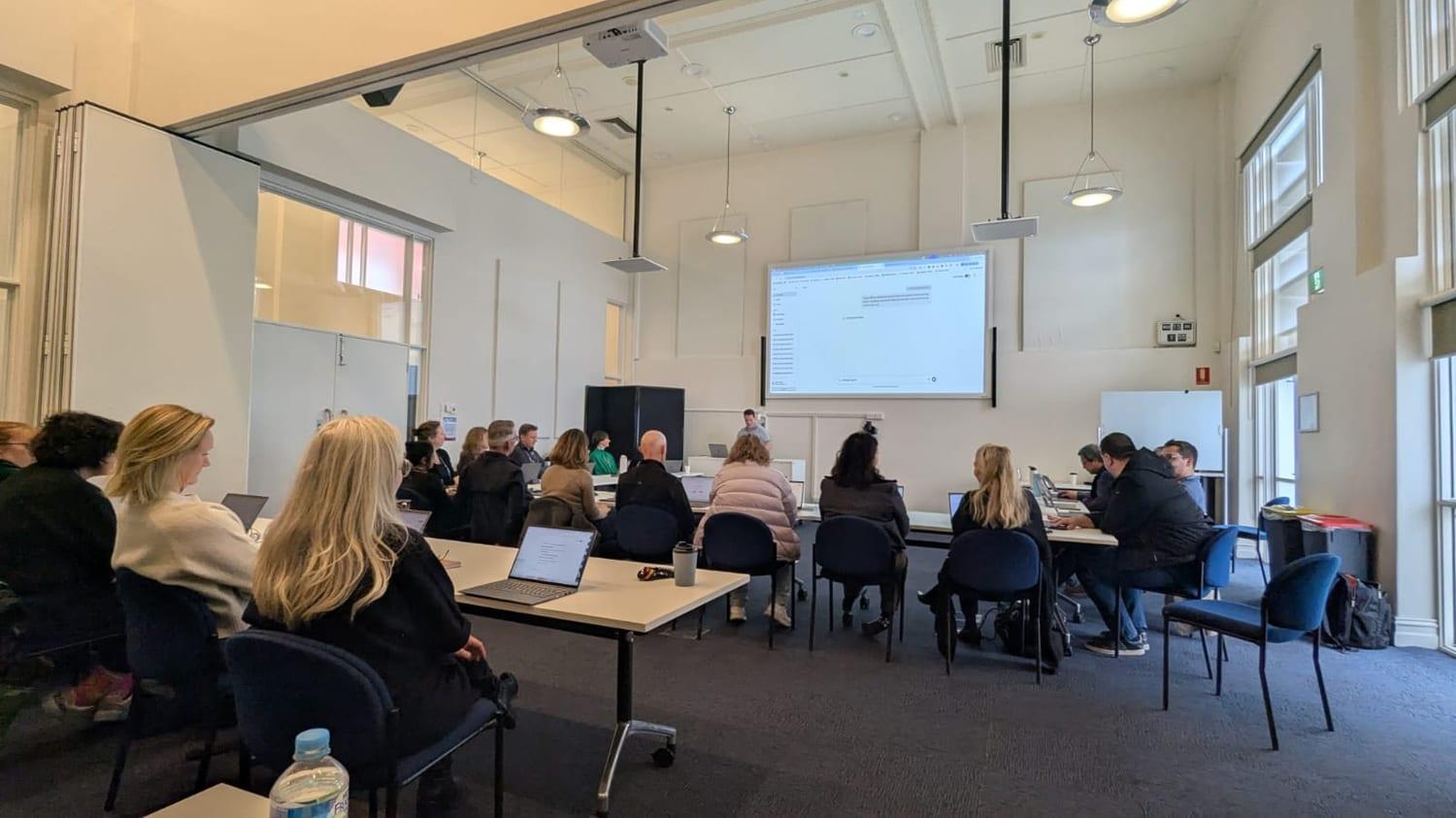 Merri-bek City Council staff working through AI prompts on their laptops during the session